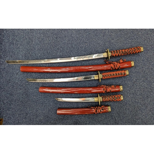 1326 - Three Samurai Swords, longest 40'', with brass hand shields.