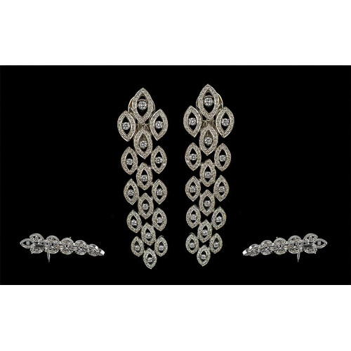 16 - A Stunning Pair of 18ct White Gold Diamond Set Drop Earrings.  Excellent design, well matched diamon... 