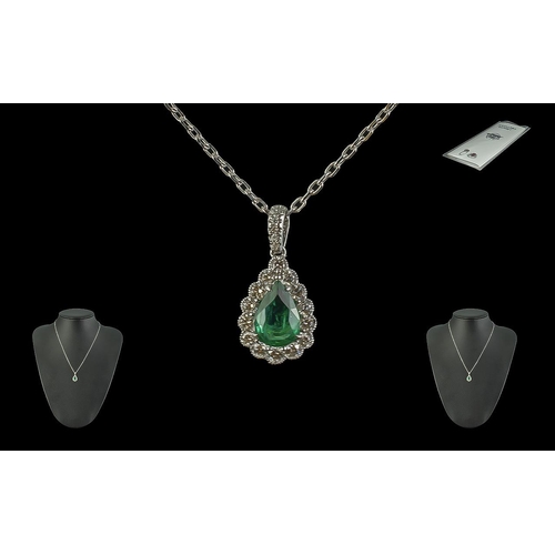 217 - Certificated 18ct White Gold Pendant set with pear shaped Emerald surrounded by Round Brilliant Cut ... 