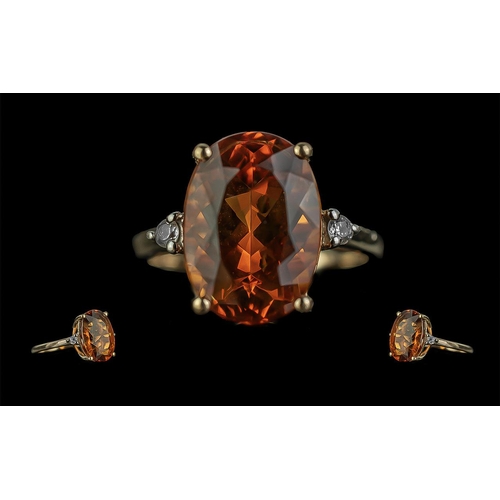 25A - Ladies Excellent 10ct Gold Orange Topaz and Diamond Set Ring. Marked 10ct to Shank. The Oval Shaped ... 