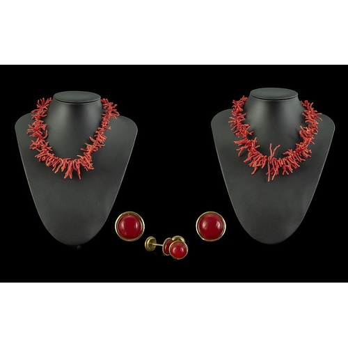 393 - Two Coral Necklaces, together with a pair of coral stud earrings, in box.