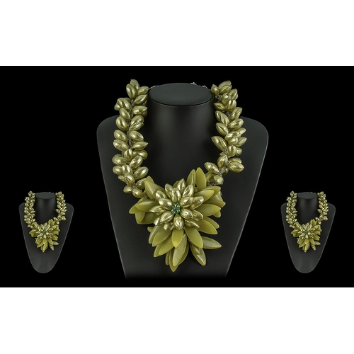 394 - Butler & Wilson Statement Necklace, in the form of a large central flower with a crystal centre and ... 