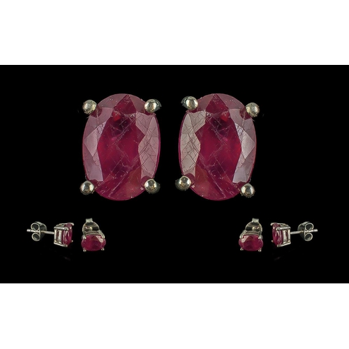 488 - Pair of Treated Ruby Studs in Silver.