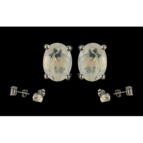 489 - Pair of Silver Stud Earrings, Set With Moonstone Cabochons.