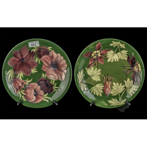 583 - Two Moorcroft Plates, 10'' diameter, one dark green with Honeysuckle pattern,  one dark green with C... 