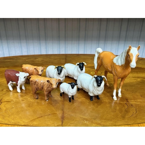 610 - Collection of Beswick Animals,  comprising a Palomino horse, four sheep, and three calves.  All in g... 