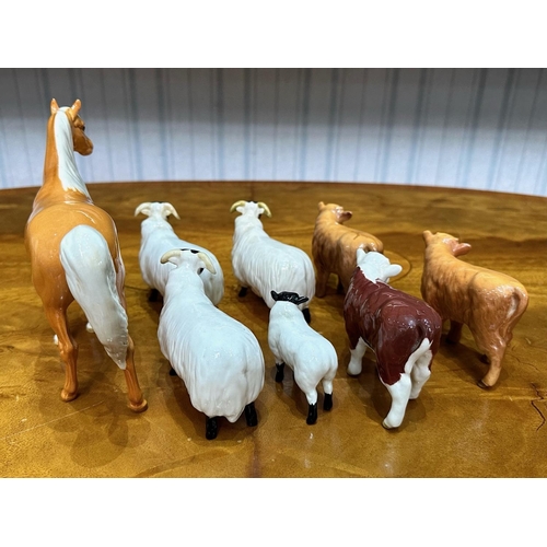 610 - Collection of Beswick Animals,  comprising a Palomino horse, four sheep, and three calves.  All in g... 