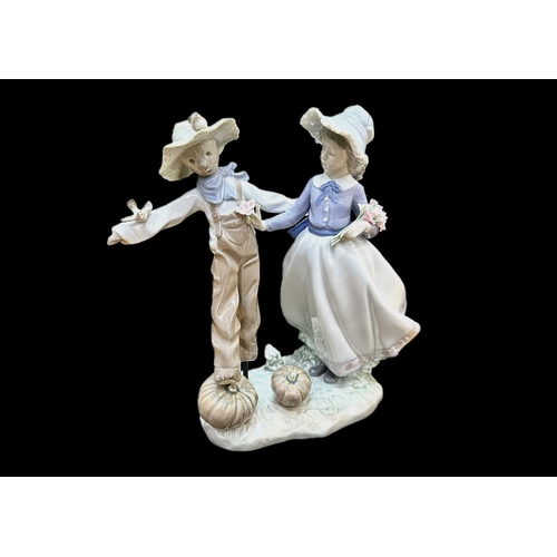 647 - Lladro Figure No. 5385, 'Lladro Figurine 5385 ''Scarecrow'' 9'' tall, depicting a lady with a scarec... 