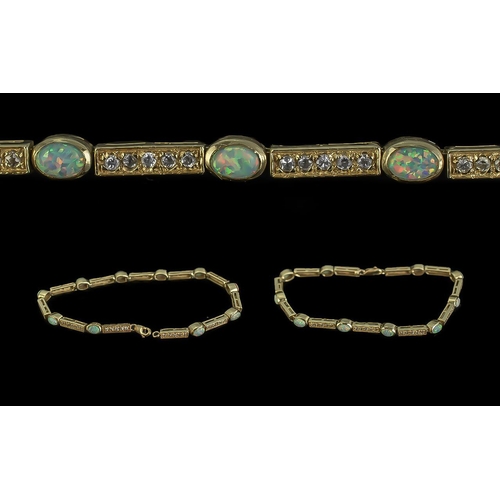 7A - 14ct Gold - Attractive Opal and Diamond Set Line Bracelet, Marked 14ct. The Ten Well Matched Opals o... 