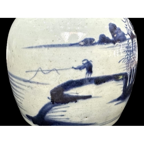 852 - Antique Chinese Glazed Jar, blue design of fisherman and houses, measures 7'' tall.