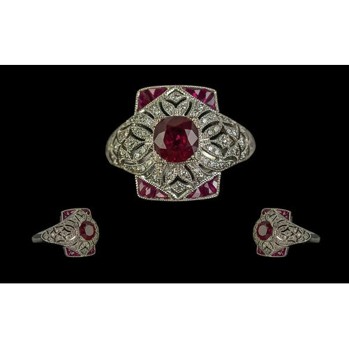 135 - Victorian-style platinum ruby and diamond dress ring, with a pierced ornate setting. Round-cut and c... 