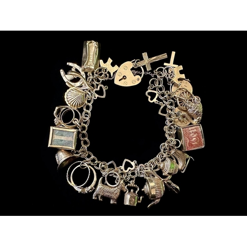 136A - Chunky 9ct Gold Charm Bracelet Loaded with Charms. Nice and Impressive and Smooth to the Touch. Appr... 