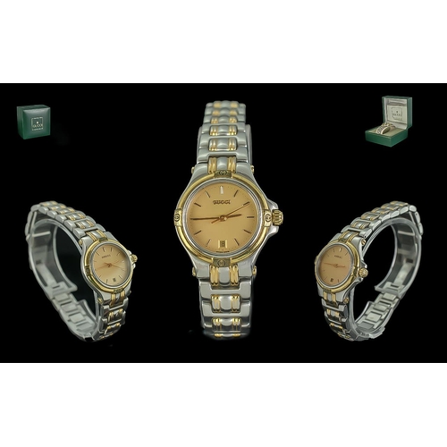 137 - Gucci Ladies Steel and Gold Tone Wrist Watch model no GU440L serial no 0007799 date of purchase 5-10... 