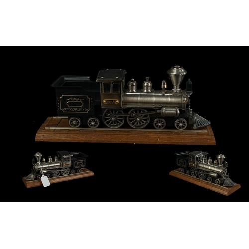 1452 - Novelty Table Lighter in the Form of a Steam Train, steel model train with a plaque inscribed 1864, ... 