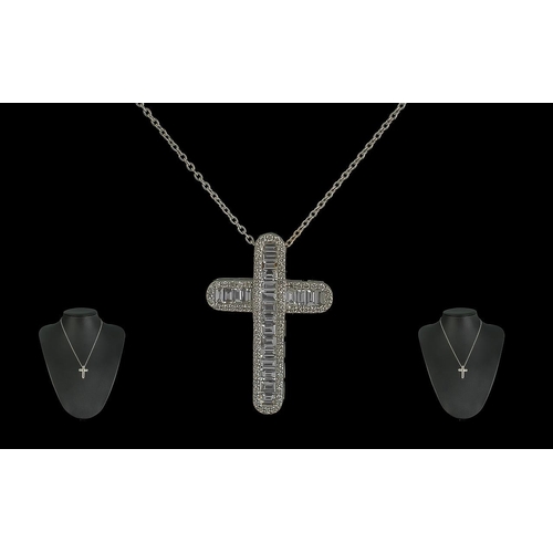 187A - 18ct White Gold Baguette-cut Diamond Cross with Round Brilliant Cut diamond set edges on an 18ct whi... 