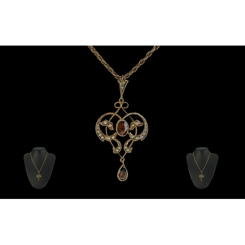 75 - Edwardian Period 1902-1910 9 ct Gold Garnet Open work Pendant of excellent form and design attached ... 