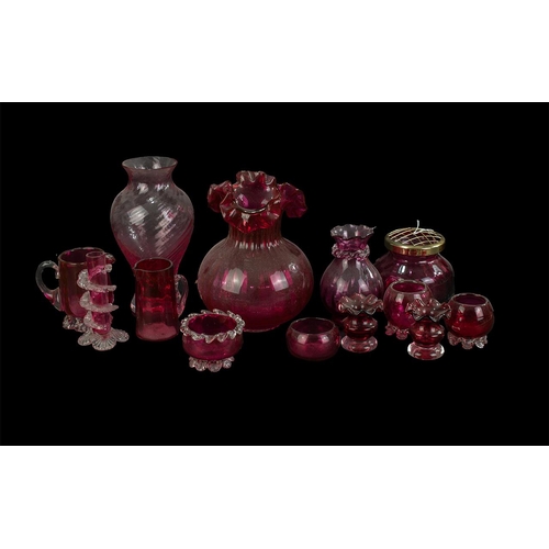 771 - Collection of Cranberry Glass, comprising vase with fluted top, rose bowl, candle holders, vases, ju... 