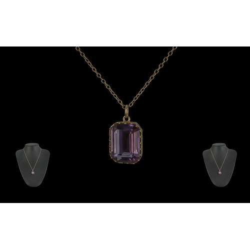 80A - Ladies 9ct Gold Amethyst Set Pendant Attached to a 9ct Chain.  Both chain and pendant marked 9ct.  T... 