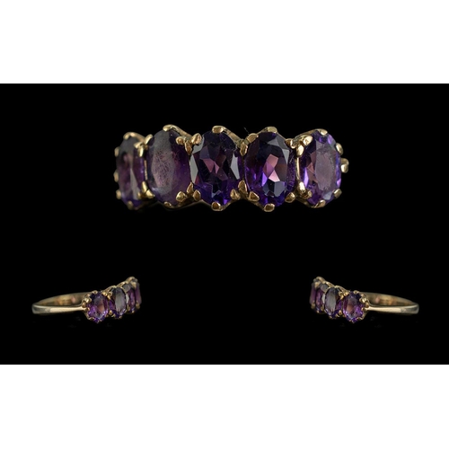 84A - Ladies 9ct Gold Pleasing 5 Stone Amethyst Set Ring, full hallmark to interior of shank.  The five we... 