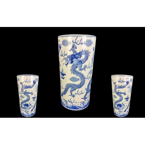 854 - Oriental Blue & White Brush Pot, decorated with dragons, height 11.5''.