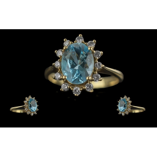 13 - Ladies Attractive 18ct Gold Aquamarine and Diamond Set Ring, flower head design, marked 18ct to inte... 