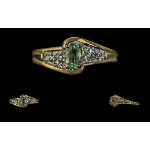 177A - 18ct Gold Ladies Dress Ring, central pale green stone on twist style diamond shoulders.  Ring size N... 