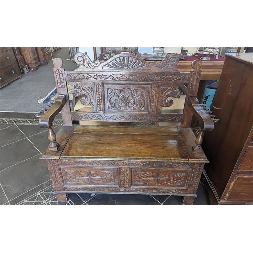 1020 - Early 20th Century Oak Monk's Bench, two seater, typical form, carved panels throughout, hinged seat... 