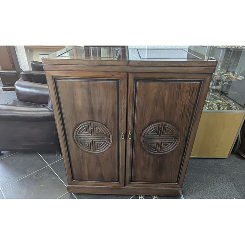 1029 - Chinese Style Cherrywood Drinks Cabinet, height 42.5'' x width 36'' x 19.5'' deep.  Hinged top, two ... 