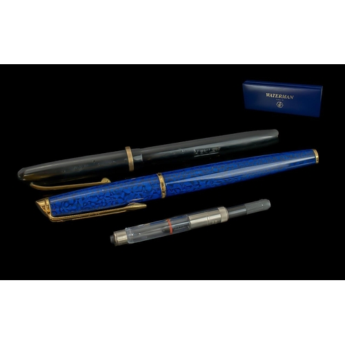 1353 - Two Waterman Pens with one original box. One in mottle blue design with gold tone nib and One with 1... 