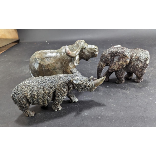 1407 - Three Cast Animal Figures, comprising a buffalo, a rhinoceros, and an elephant.  Tallest measures 6'... 