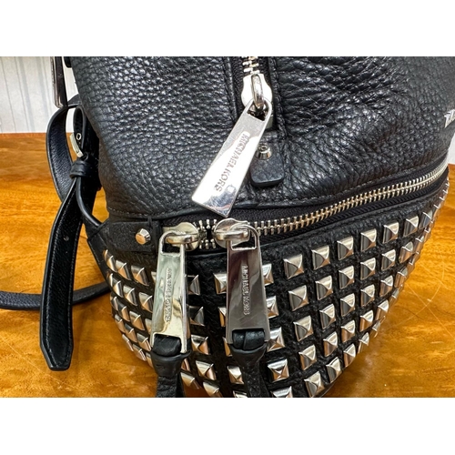 1521 - Michael Kors Interest. Ladies Michael Kors Black Leather Silver Studded Back Pack. Comes with its Or... 