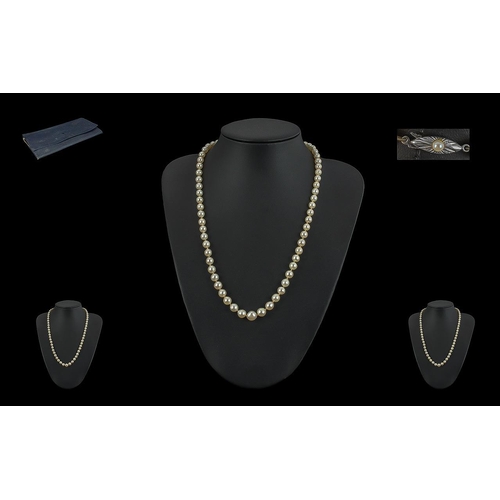 396 - Single Strand Pearl Necklace, with 18ct gold fastener, set with a small pearl.  Necklace knotted bet... 