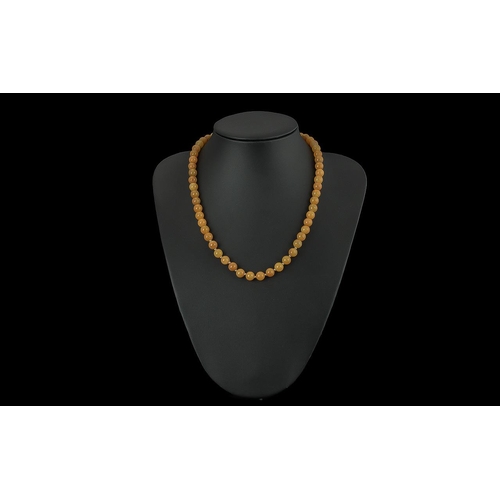 459 - Single Strand Golden Jade Necklace with 9ct gold clasp, bottom stones with gold spacers between.  18... 