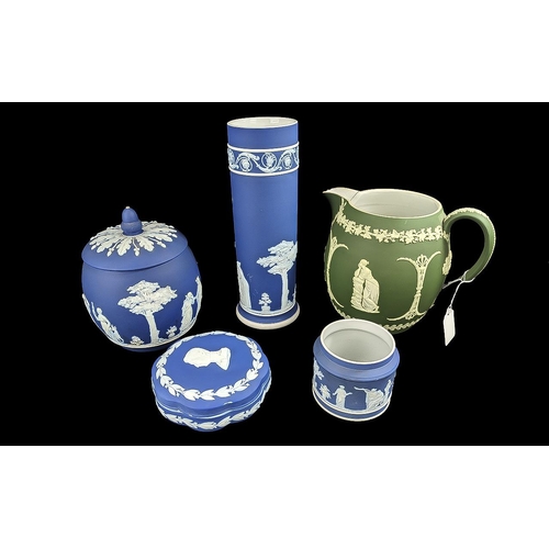 624 - Collection of Wedgwood, comprising Dark Blue Jasper biscuit barrel, lidded trinket box, tall 10'' va... 