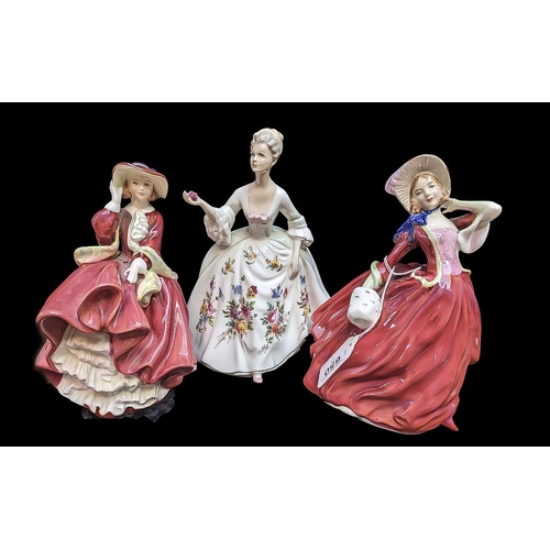 650 - Three Royal Doulton Figurines, comprising 'Top of the Hill', HN1834, 'Autumn Breezes' HN1934, and 'D... 