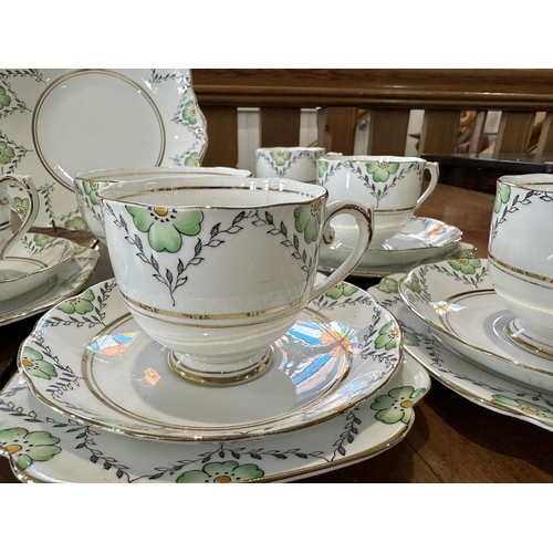 672 - Roslyn Bone China Tea Service 'Fantasy', comprises six trios of cup, saucer and side plate, bread an... 