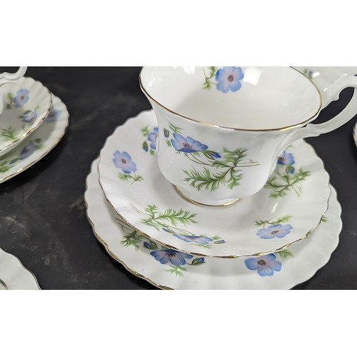 696 - Richmond Bone China Tea Set 'Blue Poppy', comprising seven trios of cup, saucer and side plate, a mi... 