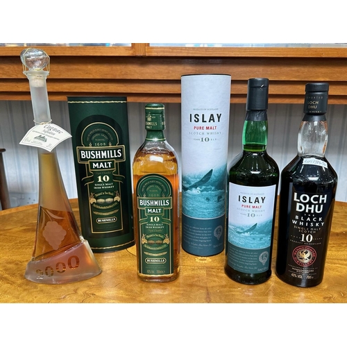 1384 - Three Bottles of Single Malt Whisky, comprising Islay Malt 10 year old, Bushmills Malt 10 years old,... 