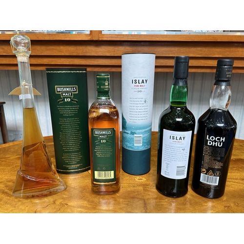 1384 - Three Bottles of Single Malt Whisky, comprising Islay Malt 10 year old, Bushmills Malt 10 years old,... 