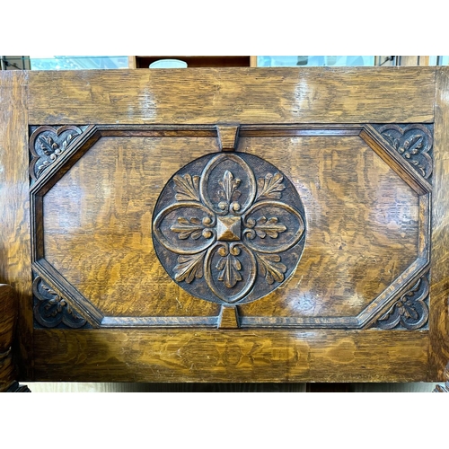 1036 - Early 20th Century Oak Monk's Bench with fold over back rest, lion carved arm rests, hinged seat and... 