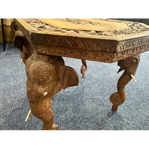 1050 - Small Indian Elephant Table, heavily carved top, four carved elephant legs, measures 21'' length x 1... 