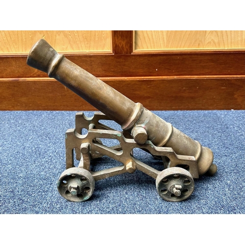 1305 - Model of a Bronze Field Cannon, on wheels, measures 18'' long.