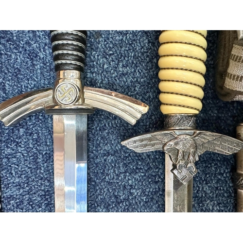 1336 - Two Copy German Daggers, Luftwaffe First & Second Pattern, together with two copy belt and buckles, ... 