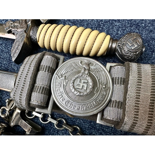 1336 - Two Copy German Daggers, Luftwaffe First & Second Pattern, together with two copy belt and buckles, ... 