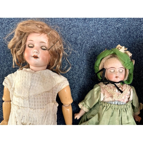 1367 - Antique German Bisque Doll, moving limbs, glass eyes and painted lips showing teeth, in need of atte... 