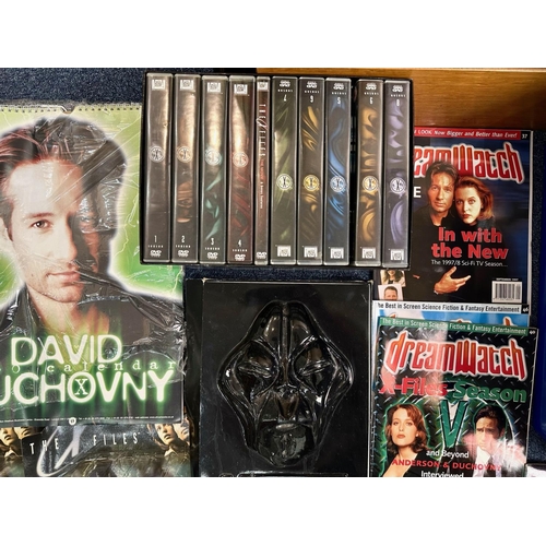 1434 - Four Boxes of X Files Memorabilia, including blister packs, DVDs, magazines, authentic film original... 