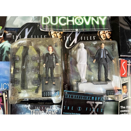 1434 - Four Boxes of X Files Memorabilia, including blister packs, DVDs, magazines, authentic film original... 