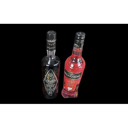 1560 - Two Bottles of Sambuca, one raspberry and one liquorice, together with ten miniature bottles of alco... 