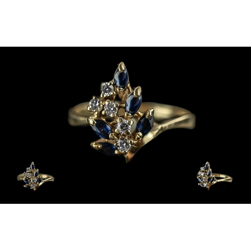 260 - 14ct gold sapphire and diamond set cluster ring. not marked but tests gold. sapphires and diamonds o... 