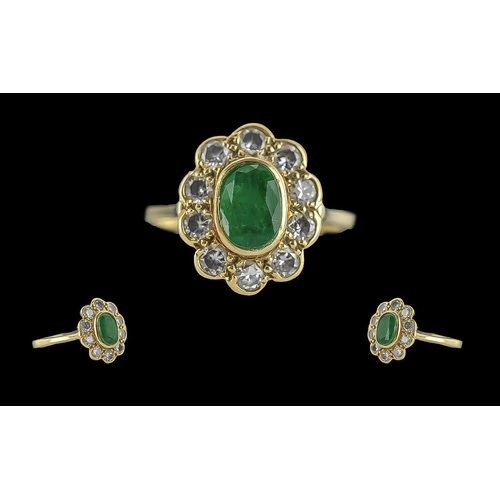 40 - Ladies 18ct gold emerald and diamond set cluster ring. full hallmark to interior of shank. the centr... 